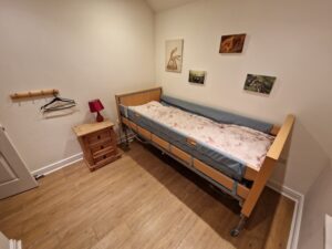 Electric Profile Bed with cot sides. Croft Bungalow